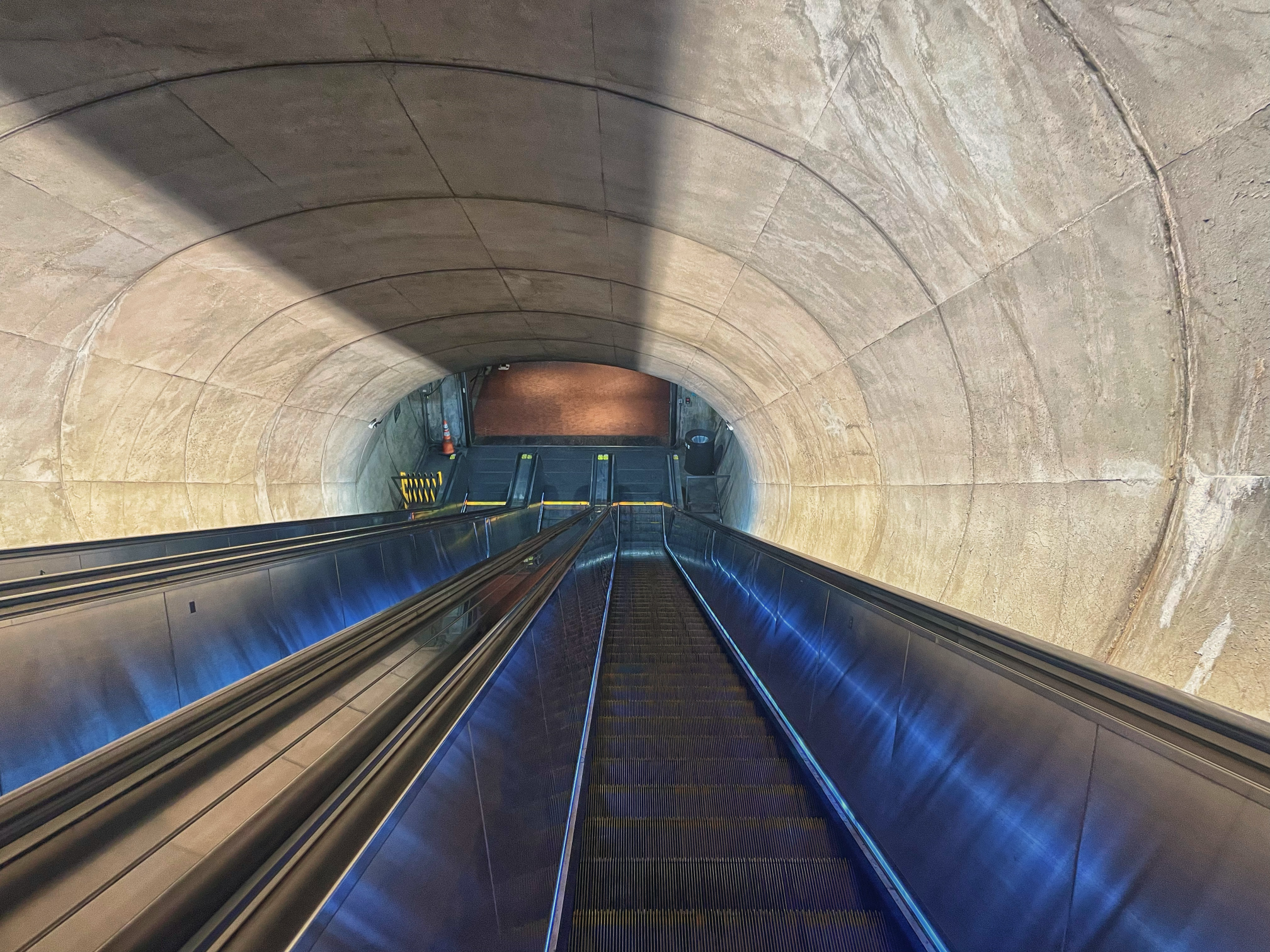 An escalator going down.